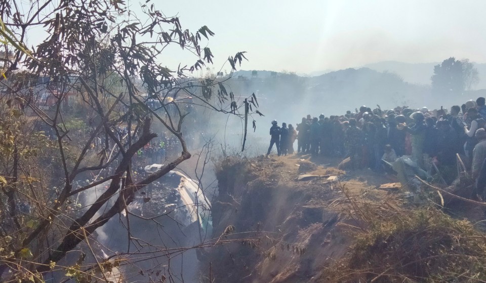 Crowds gather at the crash site