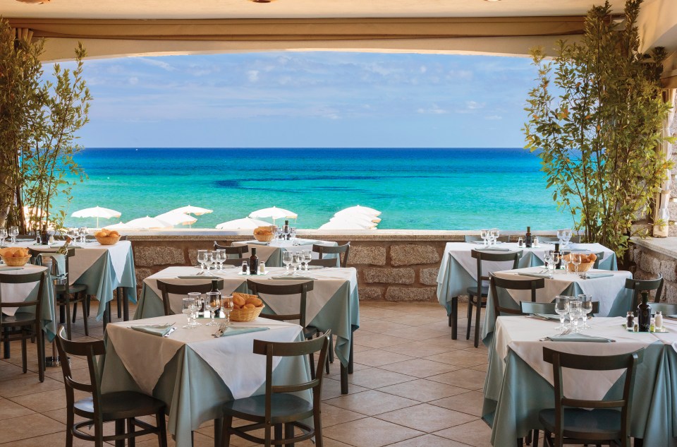 Enjoy stunning seaside dining at Resort Le Dune, overlooking the Gulf of Asinara