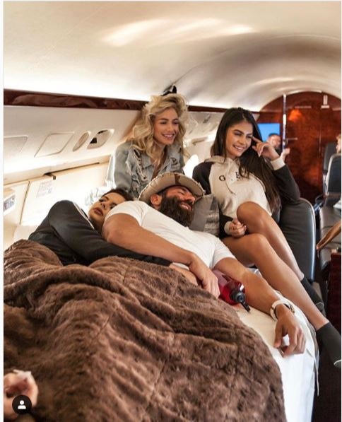 Private jet travel with a bevy of models was charged to his company books, a lawsuit alleges