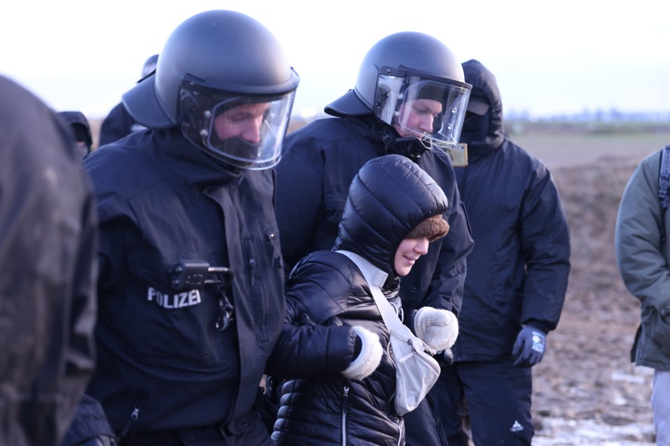 She was led away as they cleared the coal mine site