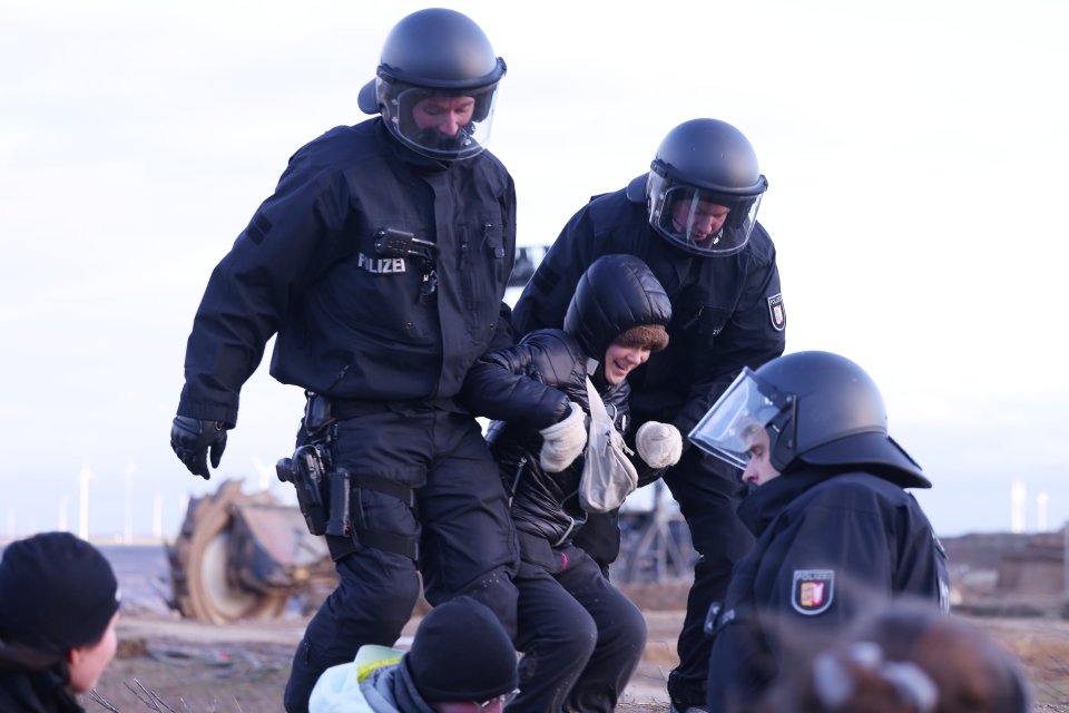 The activist appeared to be manhandled by police