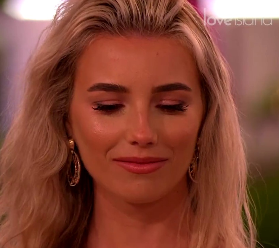 Lana is seen giving an awkward smile in tonight's Love Island