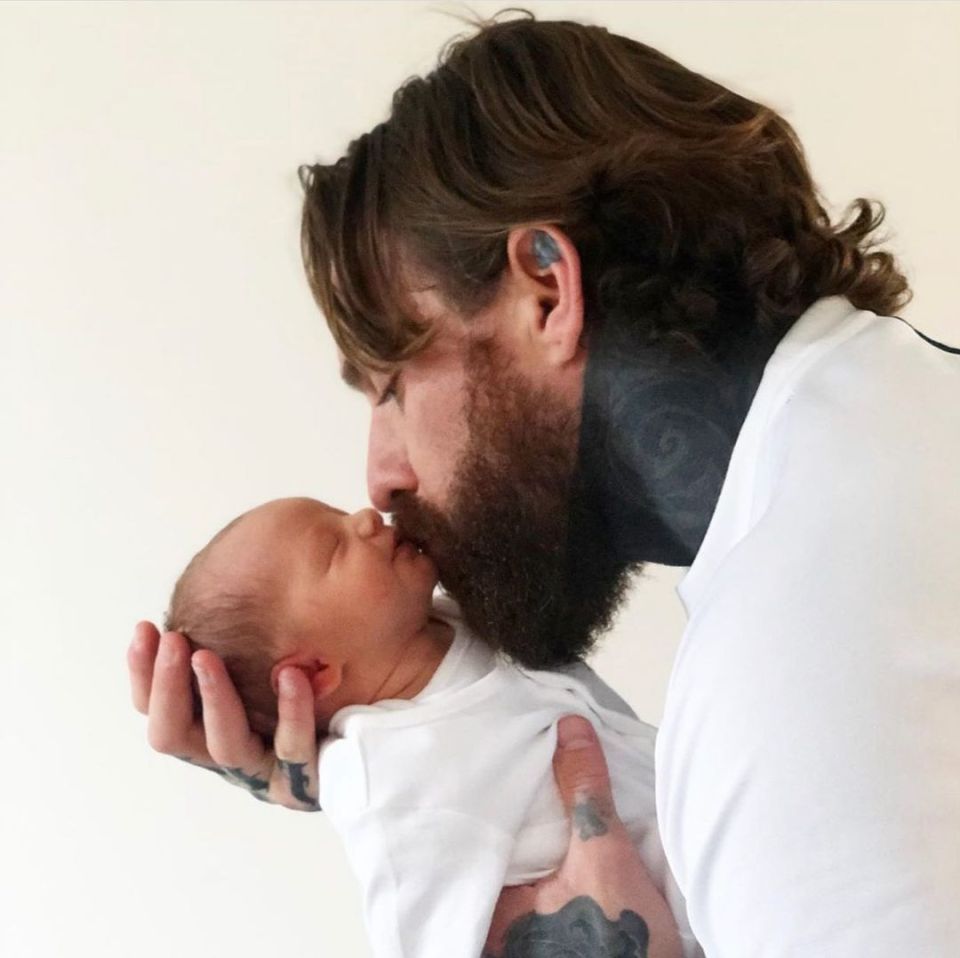 Aaron was dad-shamed by trolls for kissing his newborn son