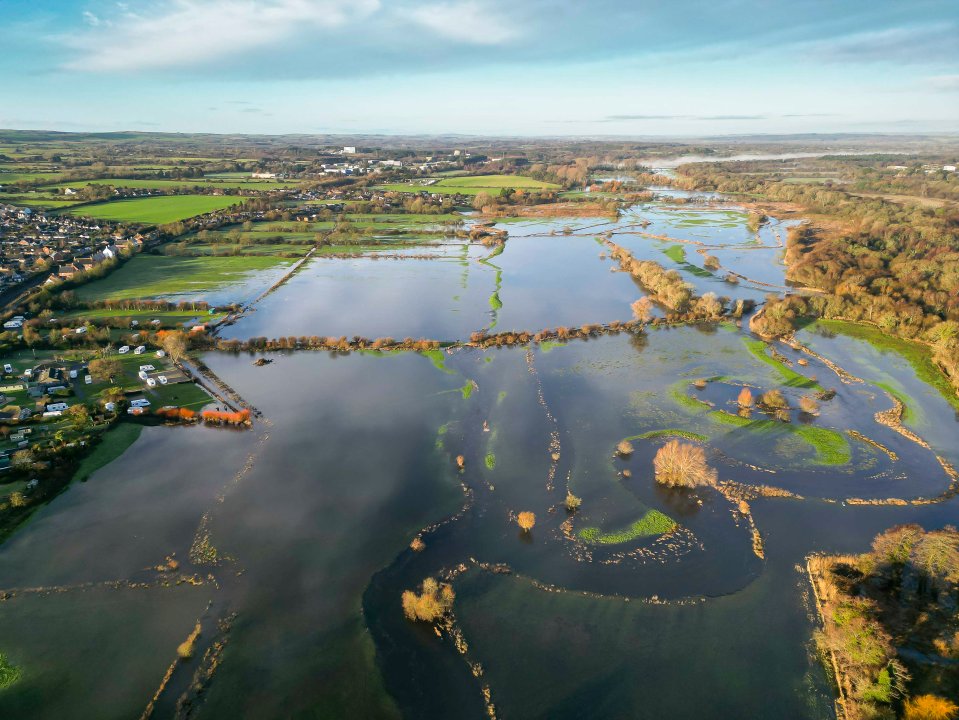 View from the air of flooded fields at Wool in Dorset after the River Frome burst its banks