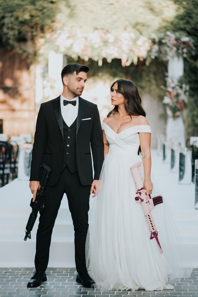 She walked up the aisle with a pink rifle while Gal had a black one