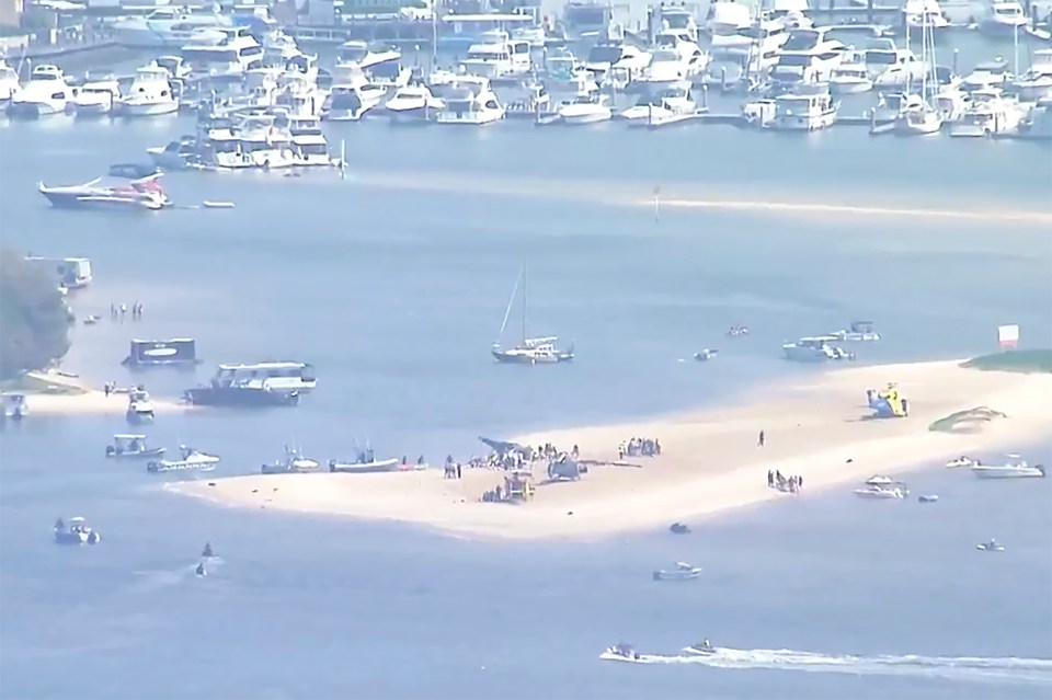 The two crashed helicopters were inspected on a sand bank following the collision