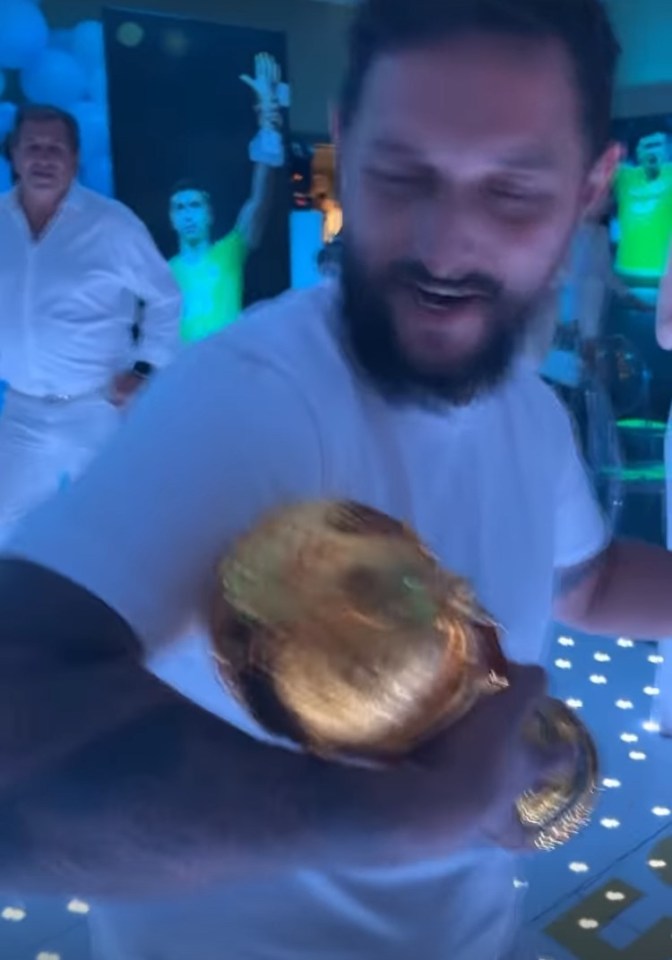 Footage showed one guest dancing with the World Cup trophy