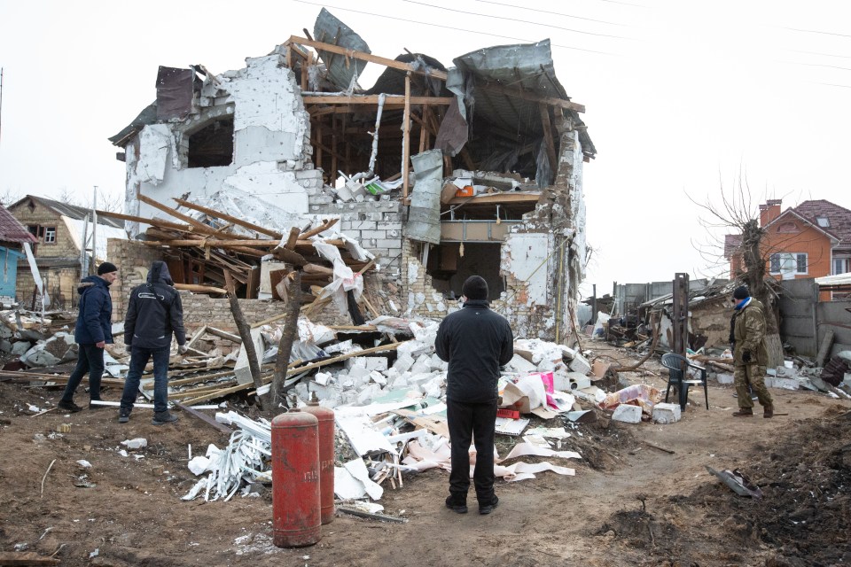 Shocked residents pictured after a Russian missile attack in the Ukrainian town of Glevakha