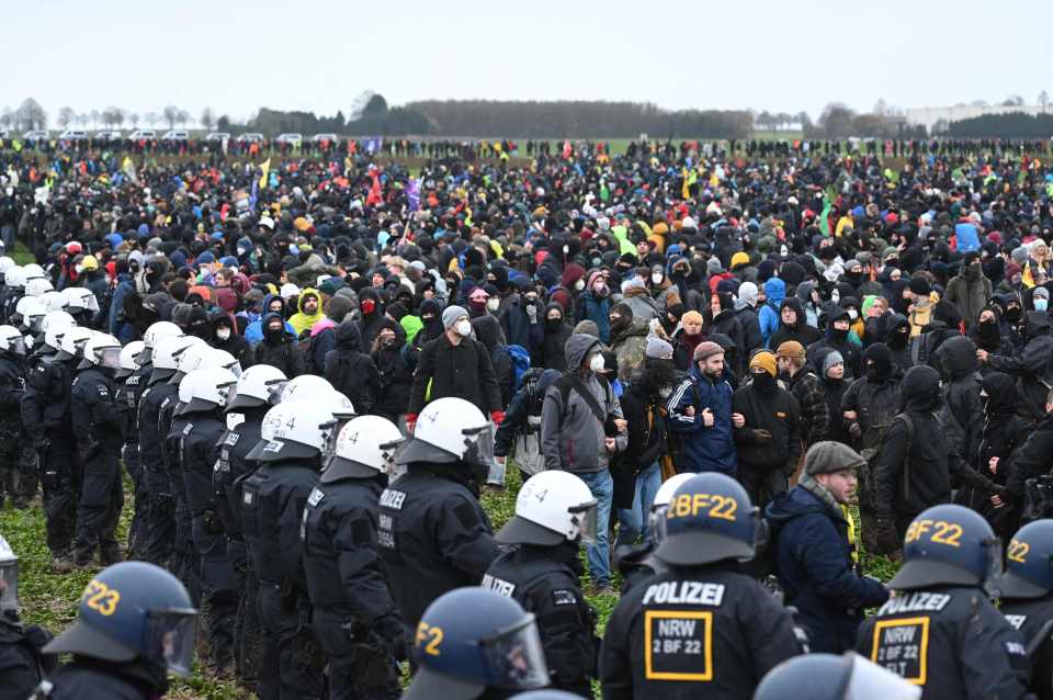 {olice face protesters during the large-scale protest