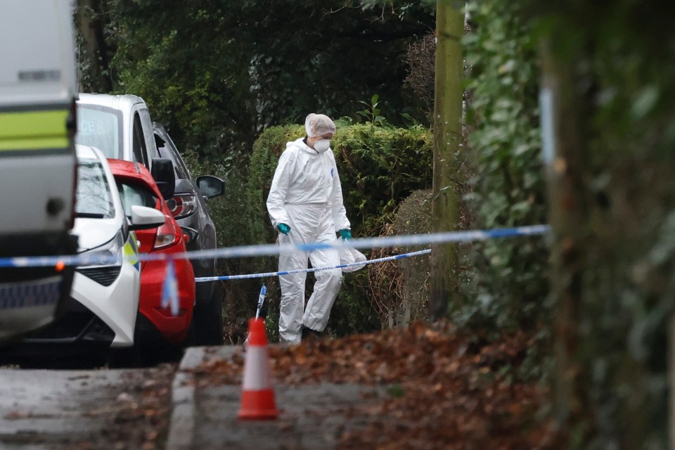 Forensic officers collecting evidence at the scene