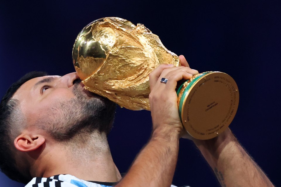 Aguero, 34, kisses the World Cup