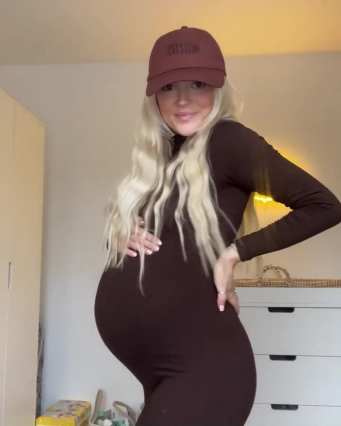 Lucy also revealed her blossoming baby bump