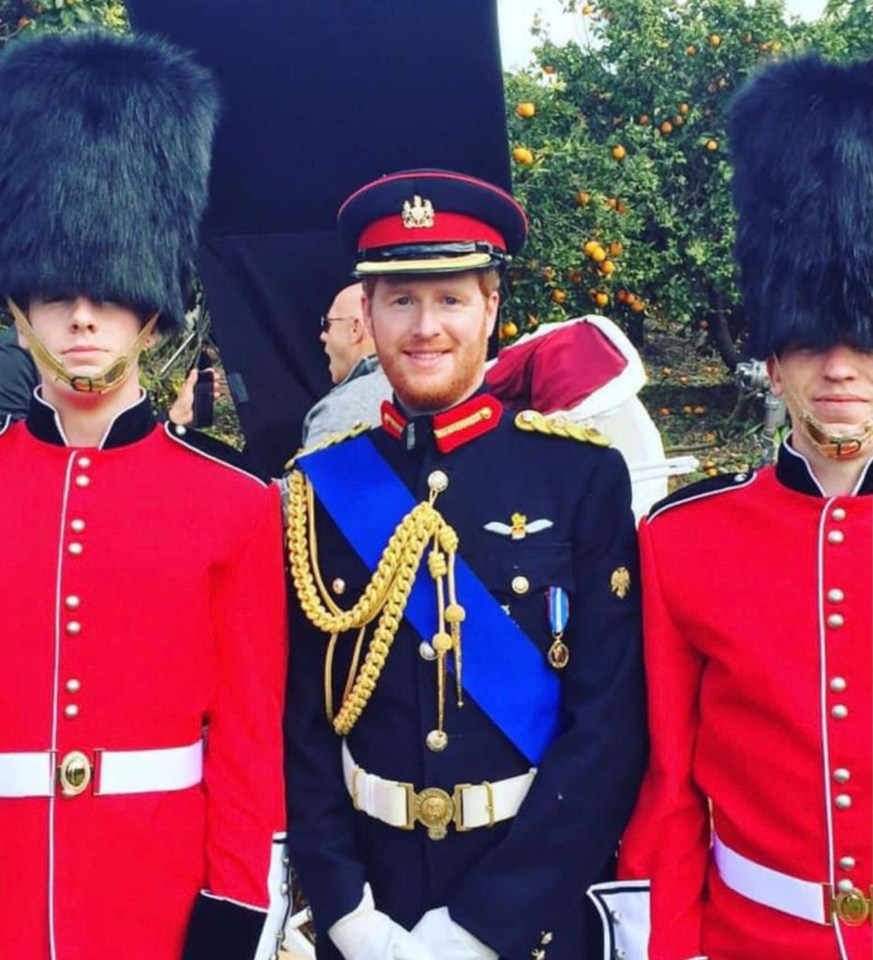 Rhys in Uniform next to Royal Guards