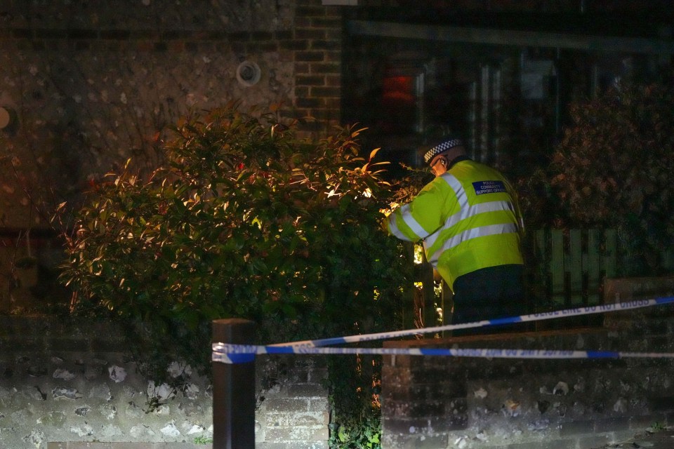 An officer searches the area close to where the couple were found