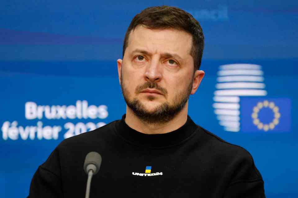 Zelensky - stone-faced and bearded - almost exactly one year into the war with Putin