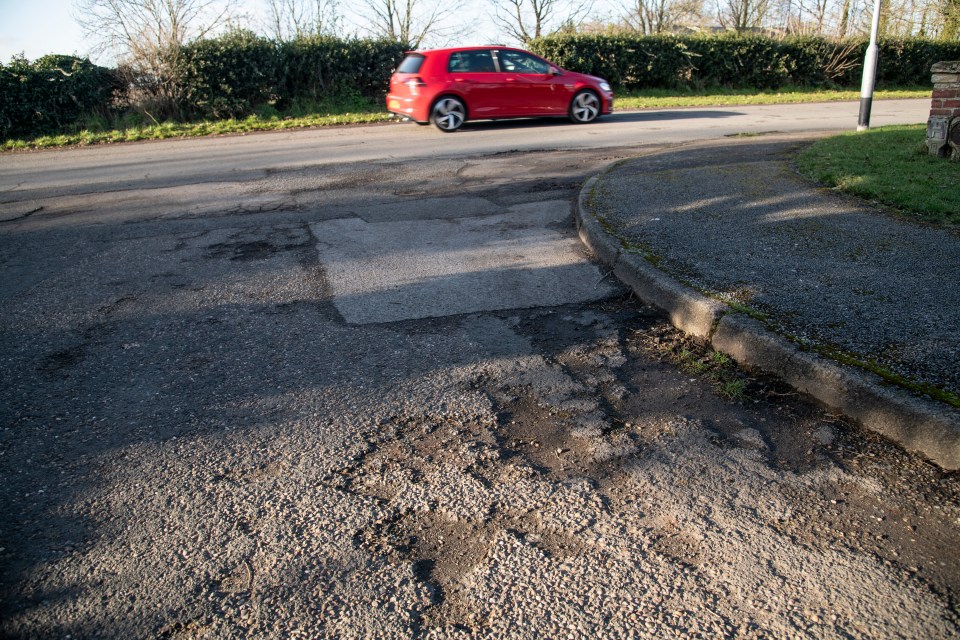 Cyclists often have to swerve into oncoming traffic to dodge dangerous potholes like this one