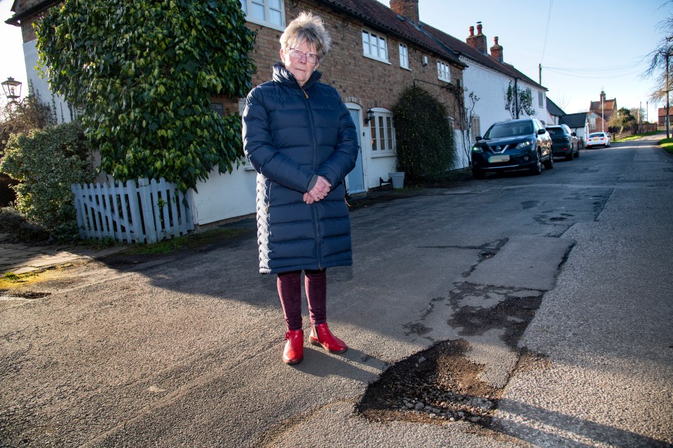 Church warden Sarah Hadfield is fuming at some of the deep potholes in Hawksworth