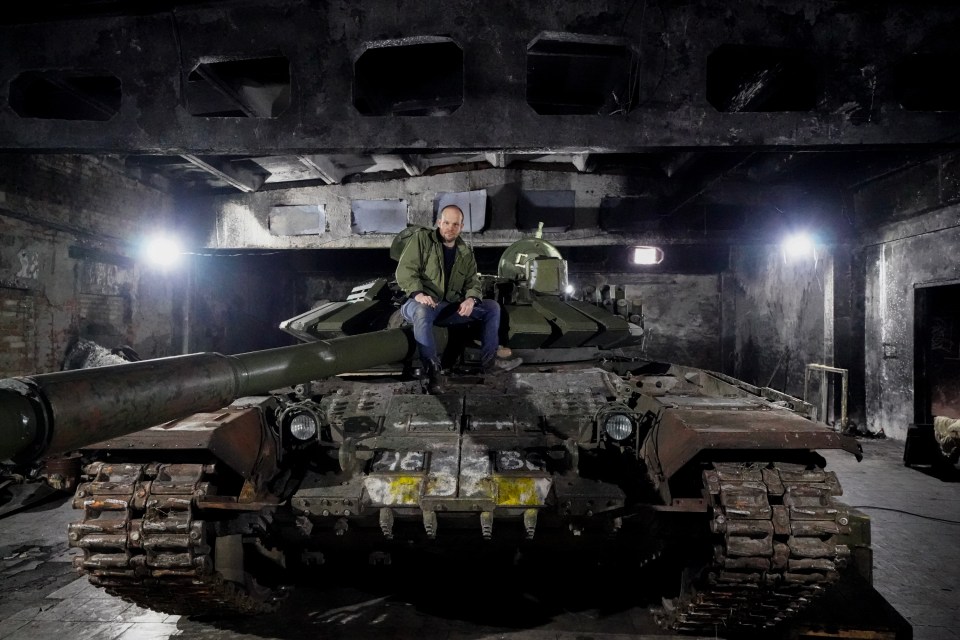 Sun man Jerome Starkey on a Russian T-72B3 tank that has been refurbished in a hidden bunker near Kharkiv