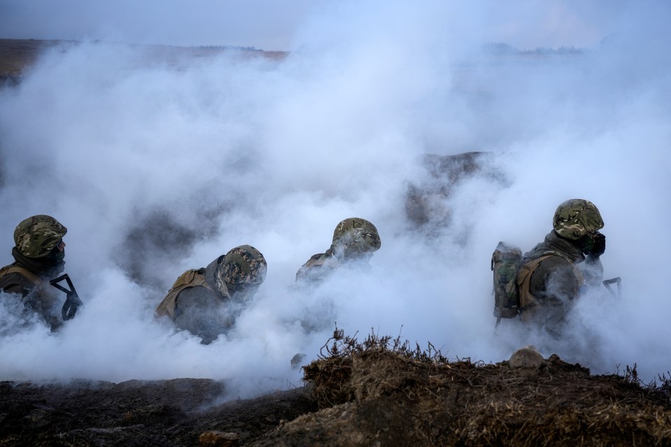 Ukrainian soldiers take part in a trench warfare training exercise in the UK