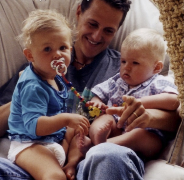 Michael Schumacher pictured with Max Verstappen, right, and his daughter Gina-Maria