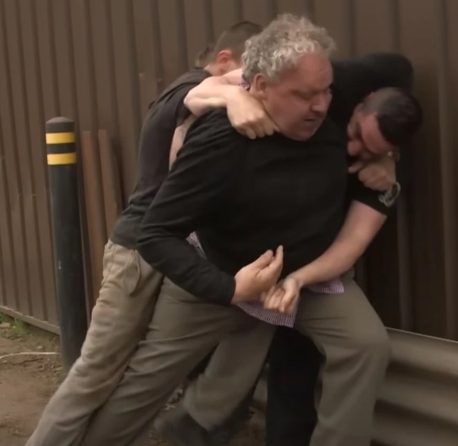 Sean says it's better to 'choke someone out' rather than try to fight them with fists (pictured: a still from one of Sean's staged reconstruction videos)