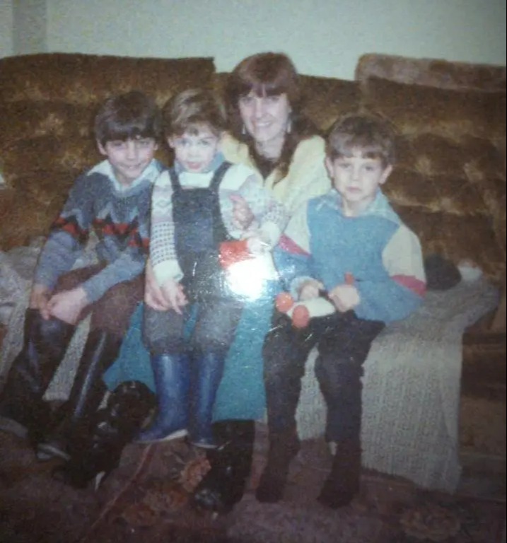 Ross (left) with his younger brothers and mum Elaine