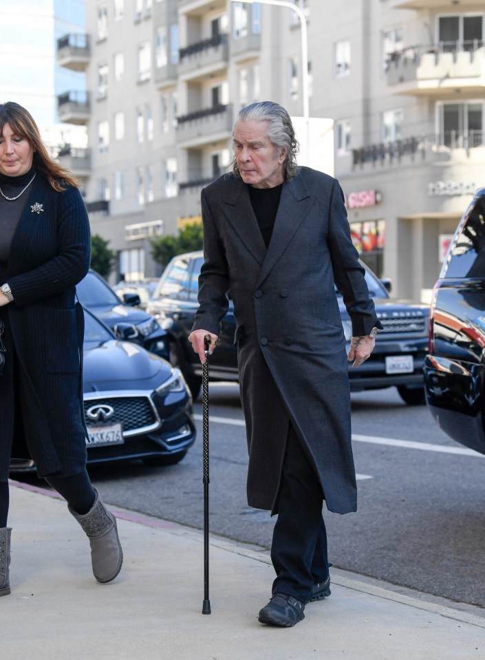 Black Sabbath icon Ozzy was photographed looking frail as he walked with the aid of a stick