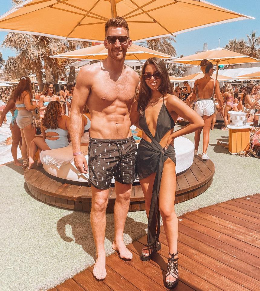 Gillespie, seen here showing off his toned body next to partner Sally Rea, lives a glam life away from football