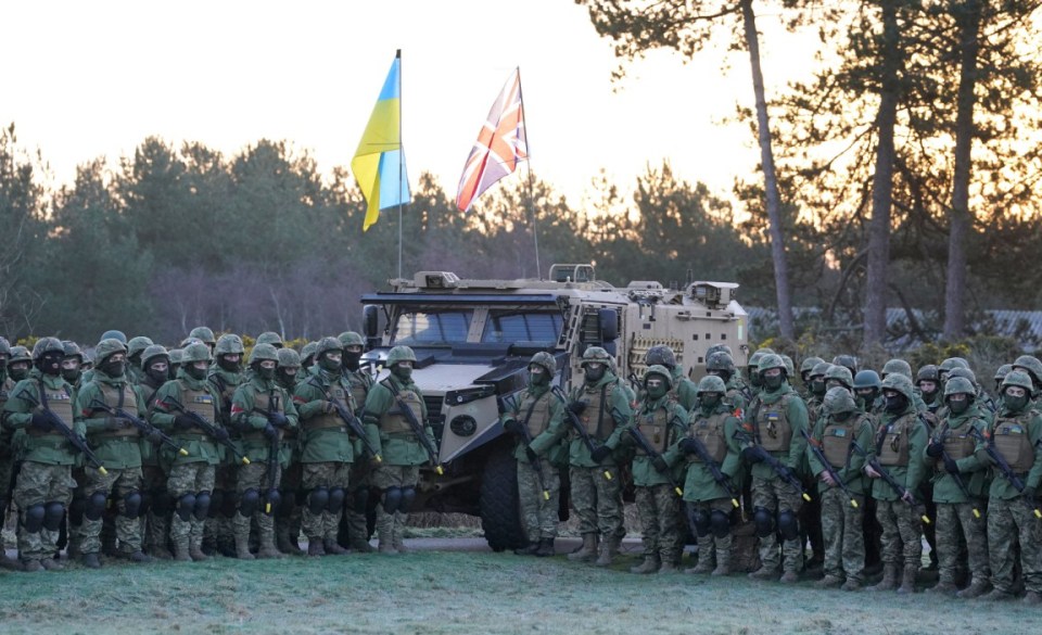 Ukrainian troops and their UK military instructors, commemorate lives lost in the Russian invasion of Ukraine at an army camp in Kent