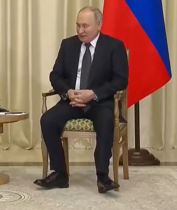 Looking puffy-faced, Putin appeared restless as Lukashenko sat still