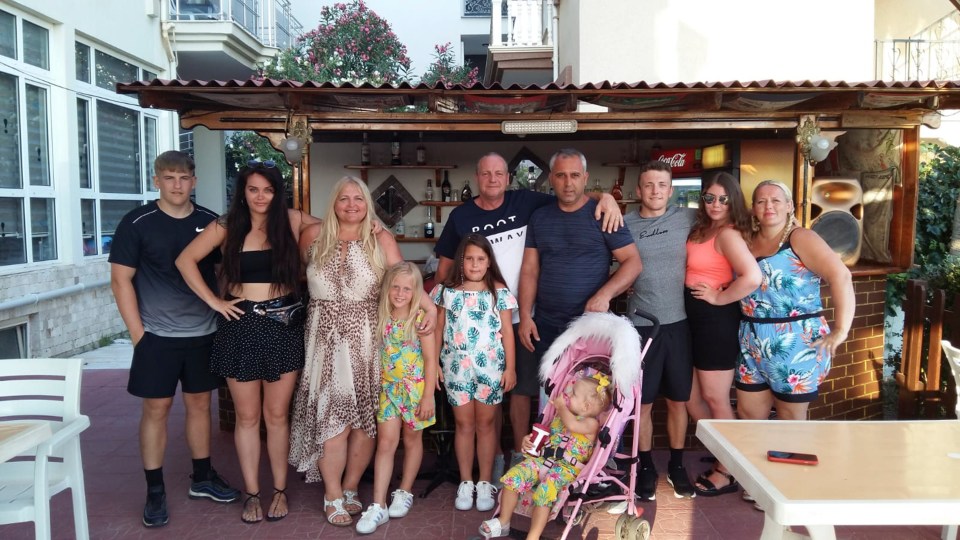 Peter and Michelle with their family on holiday