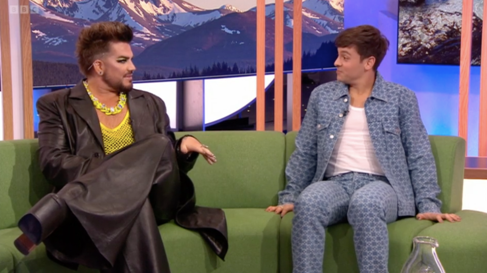 The Olympic diver appeared on the green sofa alongside Adam Lambert