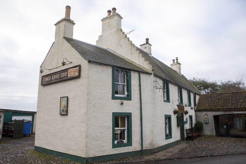 The pub's fetching white-and-green exterior