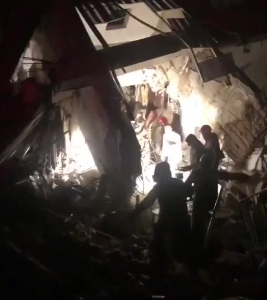 Rescuers used searchlights to hunt for survivors in his apartment block