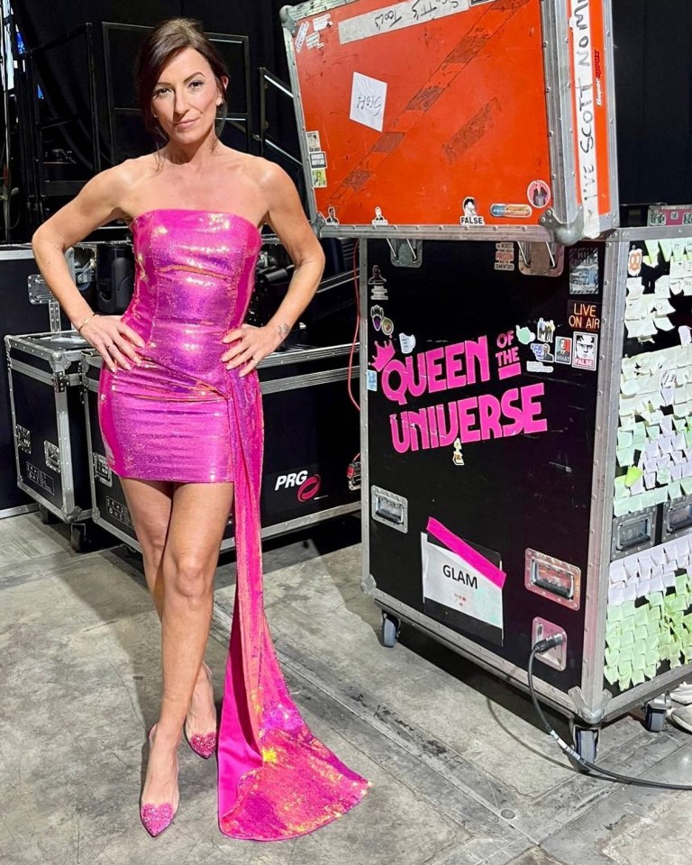 Davina looks incredible as she poses in a hot pink sparkling outfit