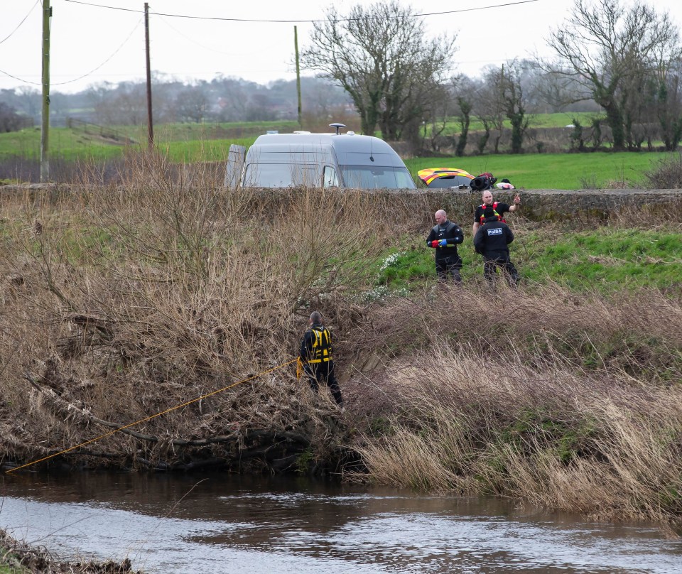 A police diving team at the River Wyre near St Michael's on Wyre