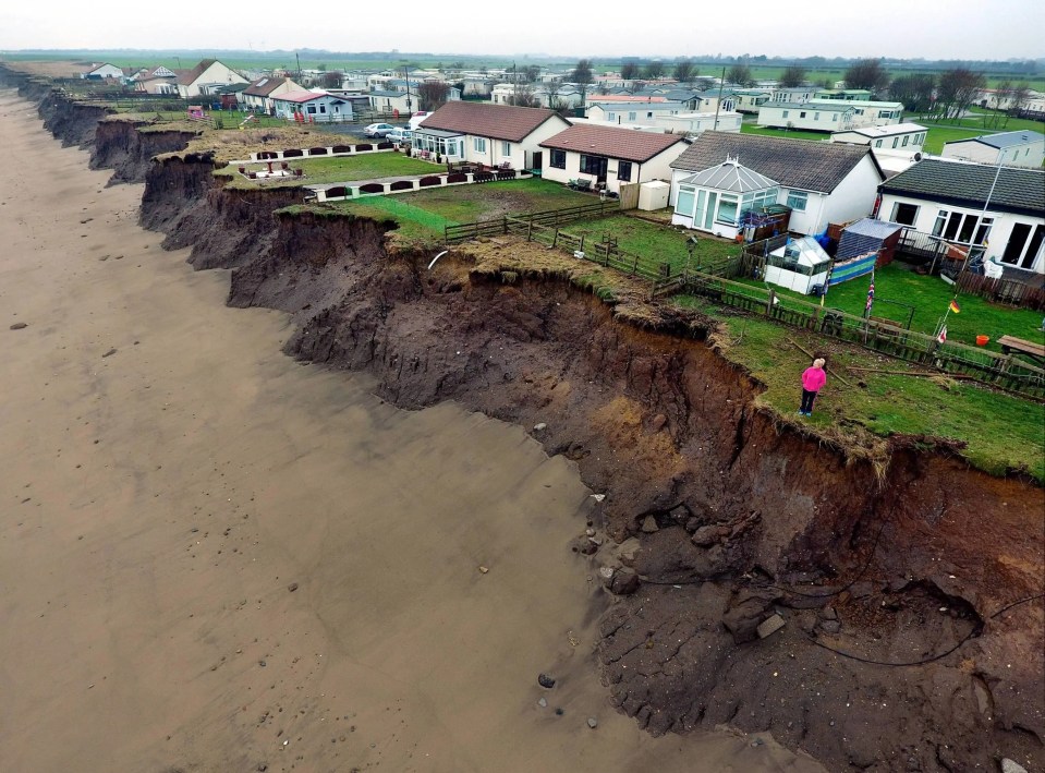 Abandoned homes and shacks are waiting to fall into the water