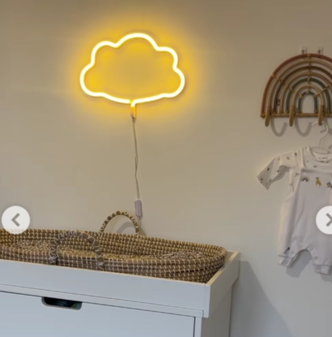 Lucy shared a sweet video of her nursery with a wicker basket and cloud light