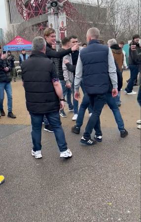 The Chelsea fan can be seen goading West Ham supporters and squaring up to some