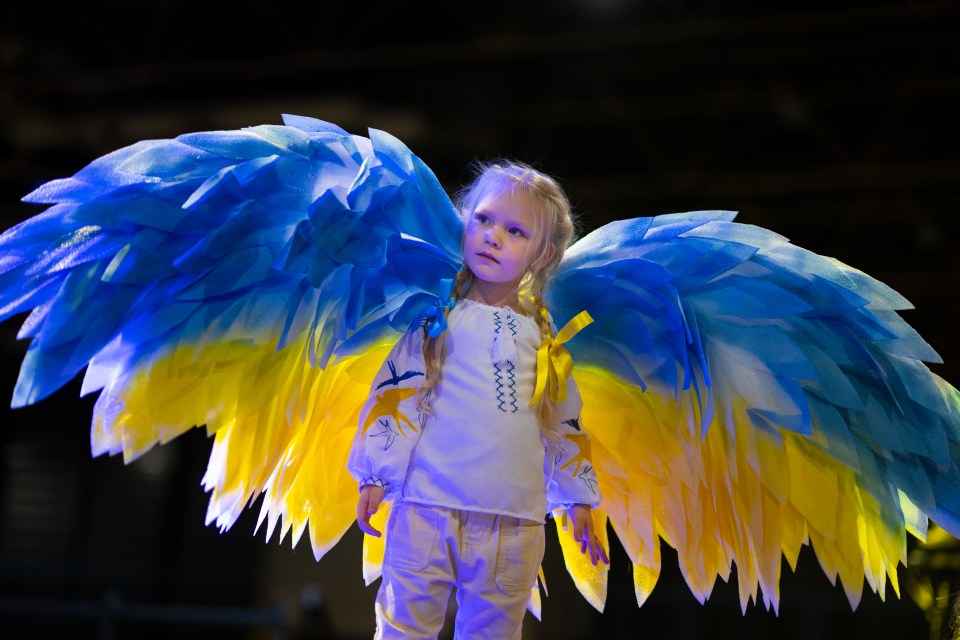 Four-year-old Stefania Lavrenko wore angel wings in the colours of the yellow and blue national flag