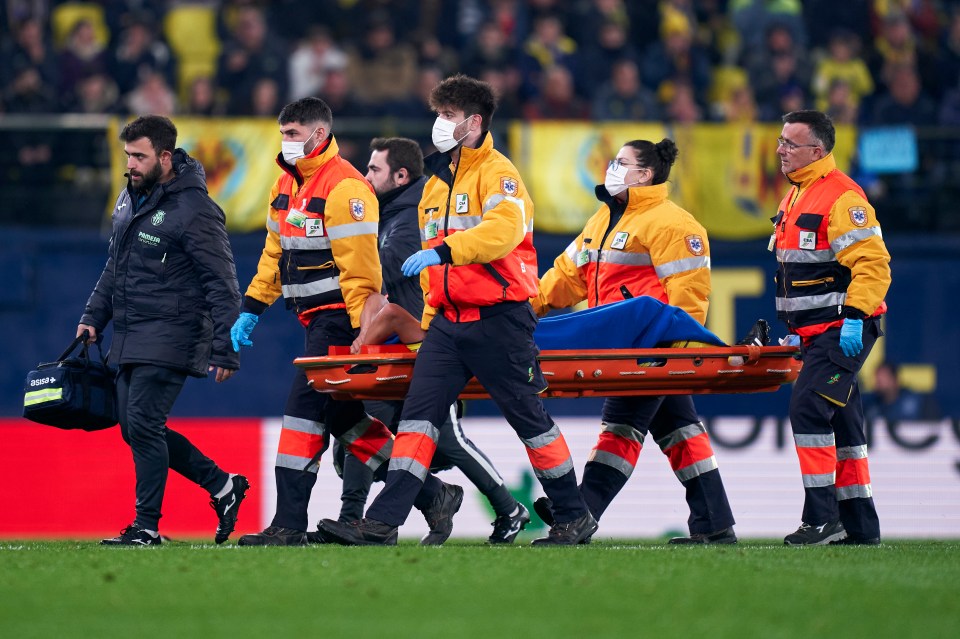 Francis Coquelin was carried off after twisting badly as he fell