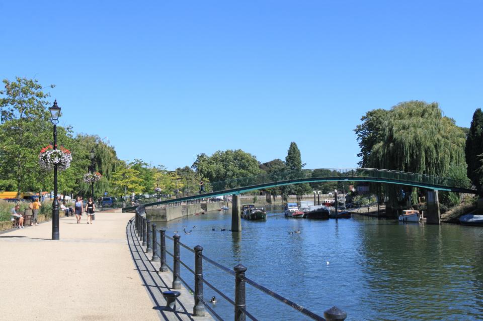 The island is accessed via a footbridge over the River Thames