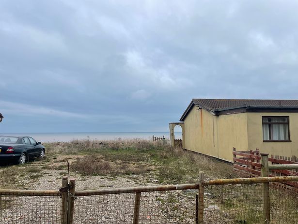 Ramshackle structures sit untouched and signs warn visitors to stay away