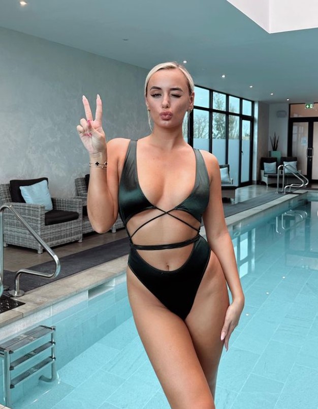 Mille Court showed off her slim figure in a revealing black swimsuit