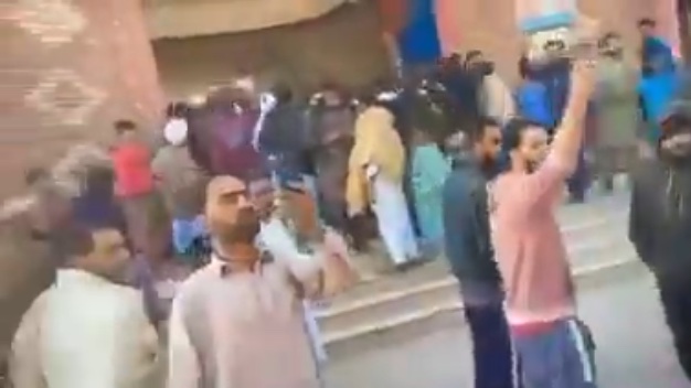 Crowds cheered after the angry mob entered the police station