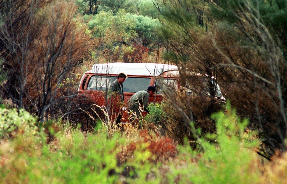 Cops examine the couple’s Kombi camper van in the Northern Territory in 2001