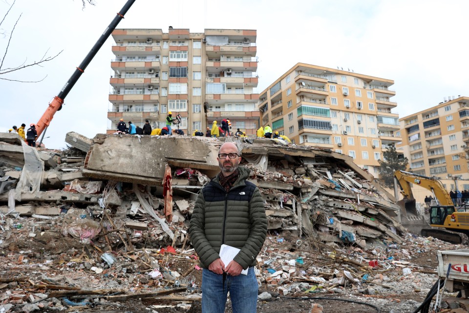 Shocked Sun man Oliver Harvey in front of the collapsed apartments