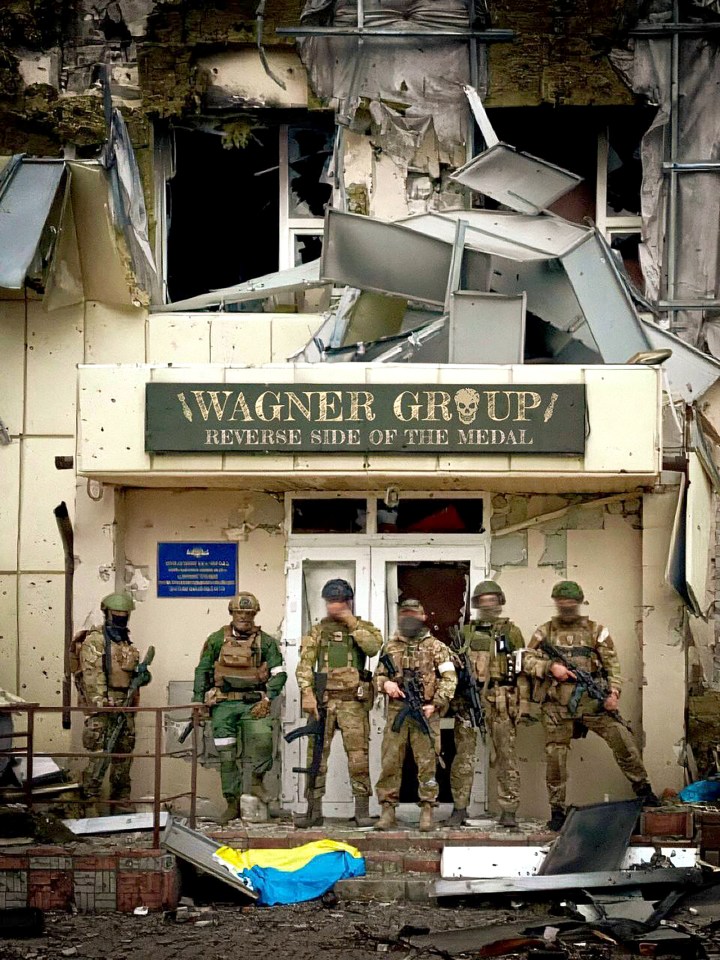 Wagner Group forces pose in eastern Ukraine where they have helped wage a relentless and ferocious war on towns and cities