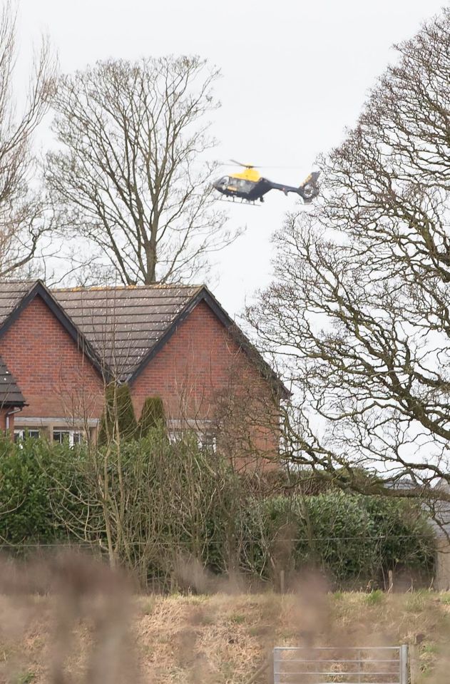 A police helicopter hovered above as a man and woman could be seen pointing to the spot where a new search was launched