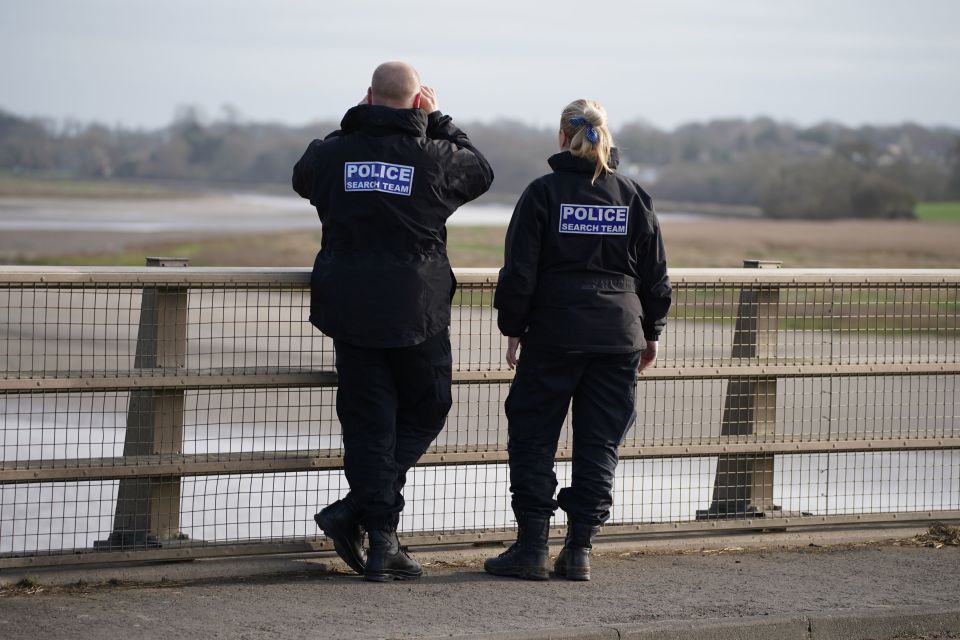 Police officers on the Shard Bridge on the River Wyre in Hambleton, Lancashire